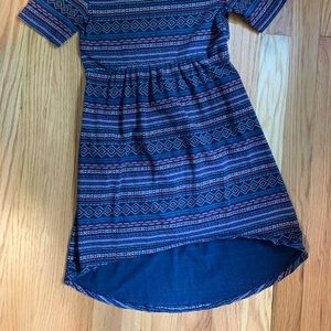 Printed cotton hi lo girls dress. Features a scoop back.